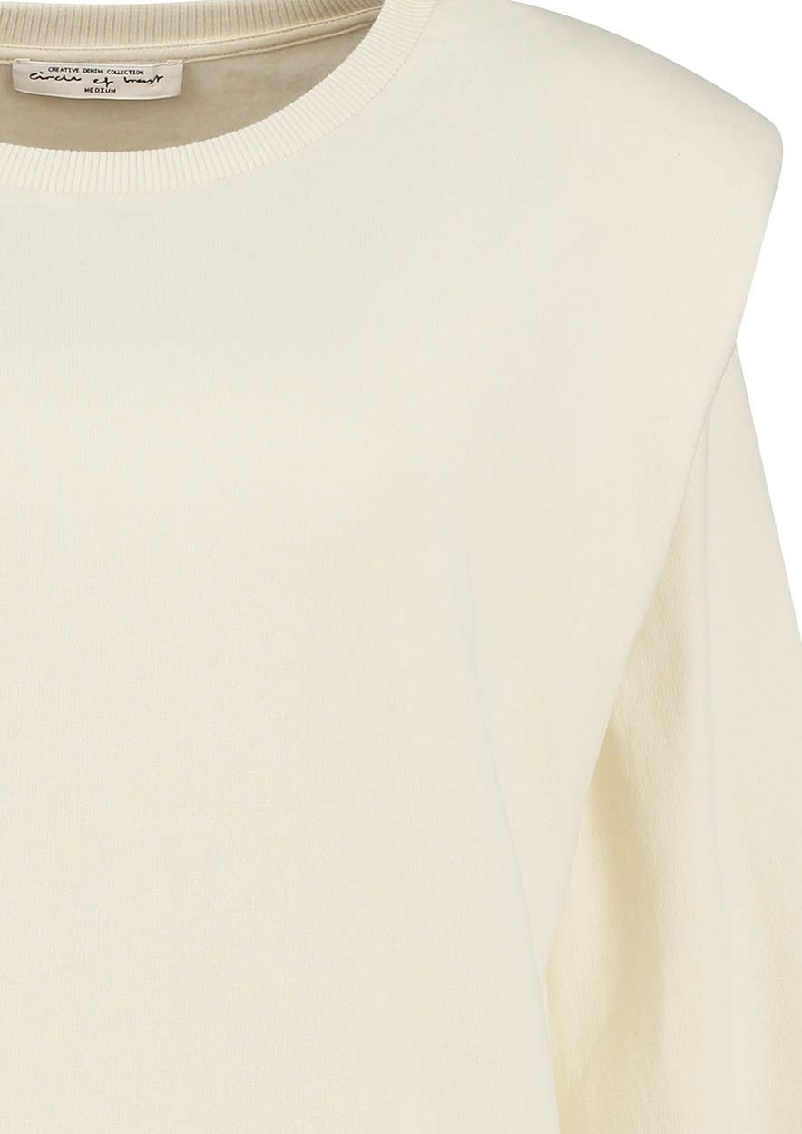 KYANA GEBROKEN WITTE SWEATER MET SCHOUDERDETAIL 
