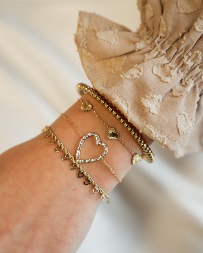 GEDRAAIDE ARMBAND OPEN HARTJES GOUD