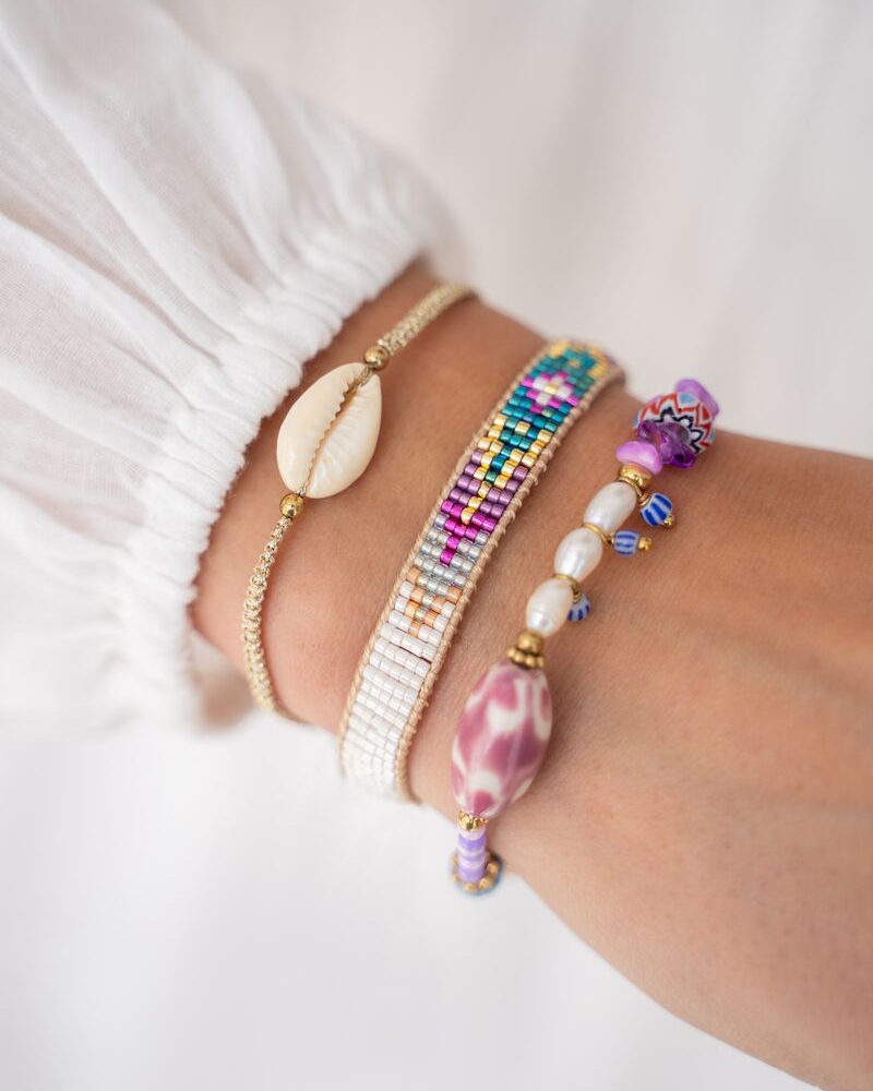 ART PAARSE KRALEN ARMBAND GOUD