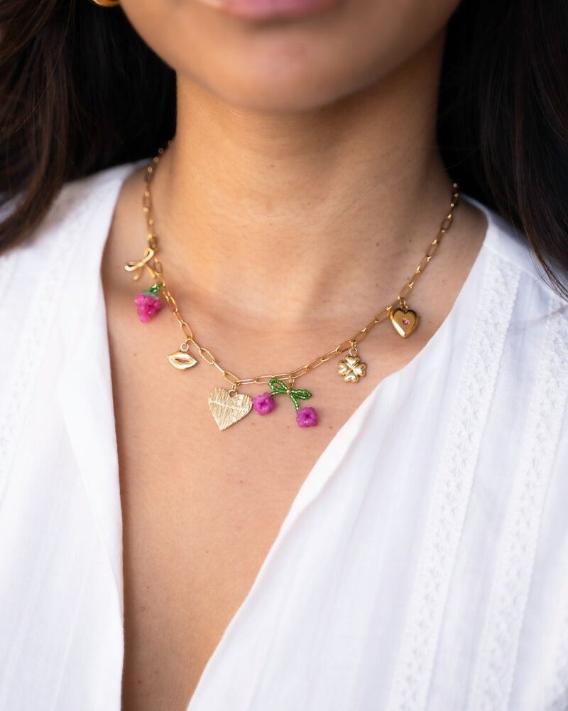 SCHAKELKETTING MET VERSCHILLENDE BEDELS KERS GOUD