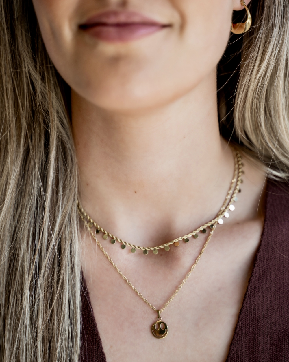 GEDRAAIDE KETTING MET MUNTJES GOUD